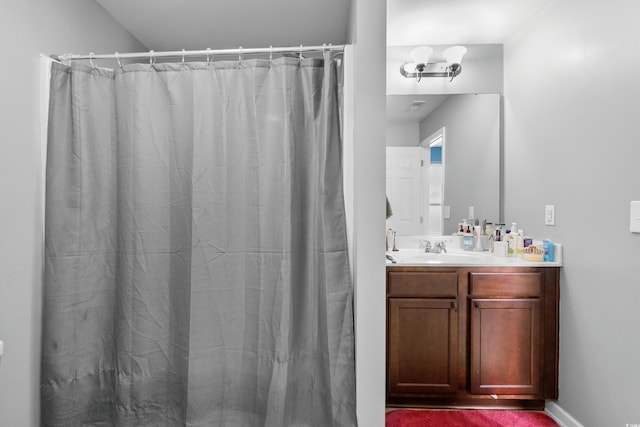 bathroom with vanity and a shower with shower curtain