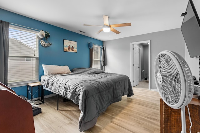 bedroom featuring wood-type flooring and ceiling fan