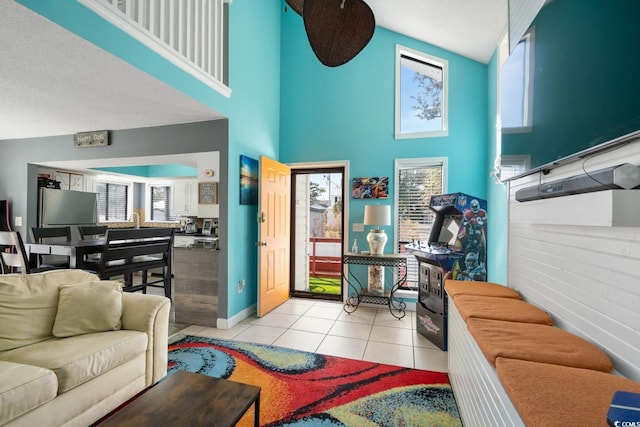 tiled living room with a towering ceiling