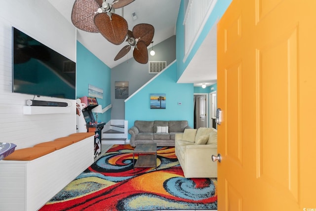 living room with ceiling fan and vaulted ceiling