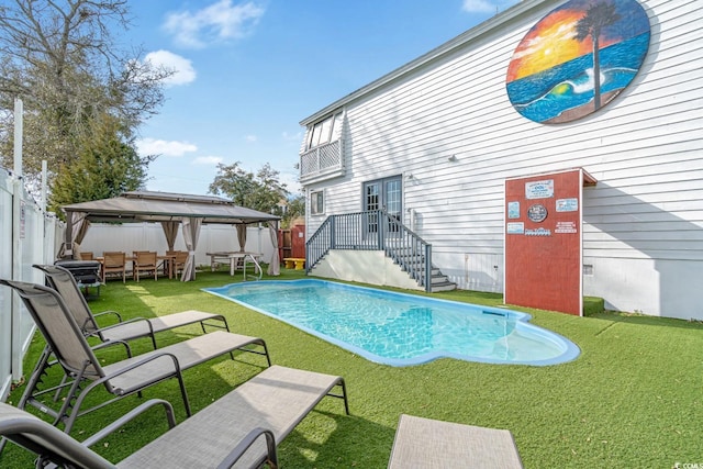 view of pool featuring a gazebo and a lawn