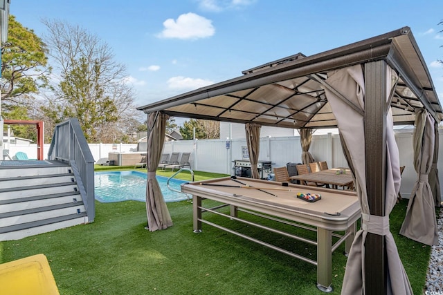 exterior space with a fenced in pool and a gazebo