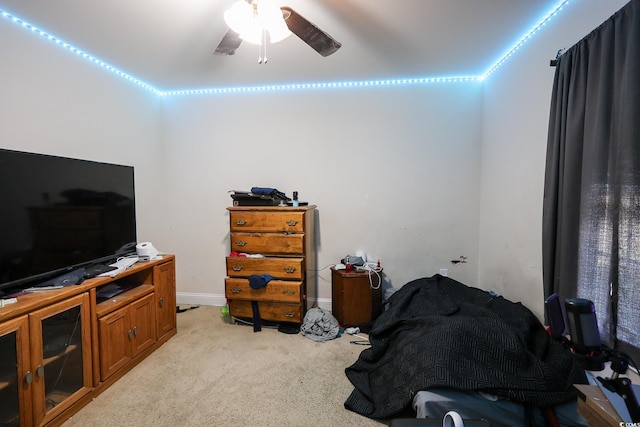 interior space featuring baseboards and light colored carpet