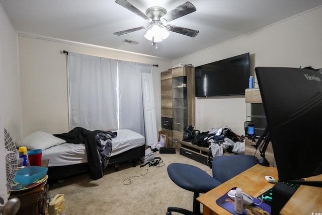 carpeted bedroom featuring visible vents and ceiling fan