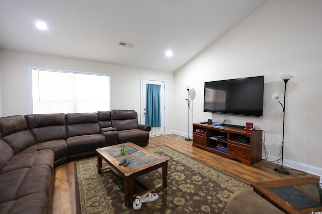 living room with lofted ceiling, wood finished floors, visible vents, and recessed lighting