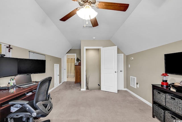 carpeted office with vaulted ceiling and ceiling fan