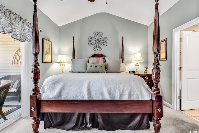 bedroom featuring lofted ceiling and light carpet