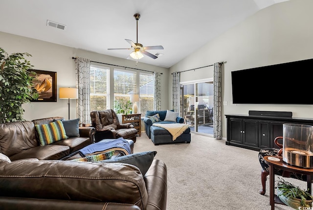 carpeted living room featuring lofted ceiling and ceiling fan