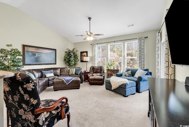 carpeted living room featuring lofted ceiling and ceiling fan