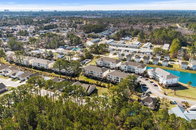 drone / aerial view with a residential view and a water view