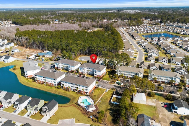 birds eye view of property featuring a water view and a residential view