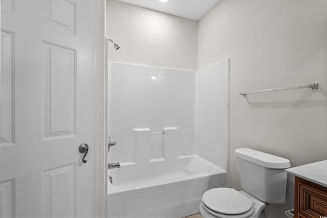 bathroom featuring vanity, toilet, and shower / bathtub combination