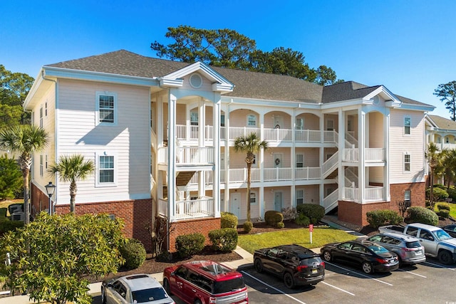 view of property featuring uncovered parking