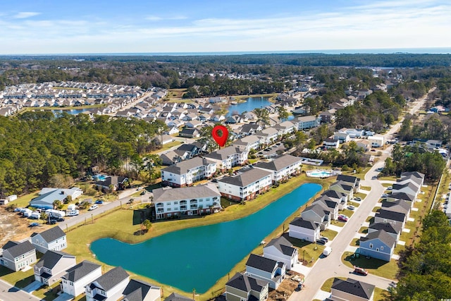 birds eye view of property featuring a residential view and a water view