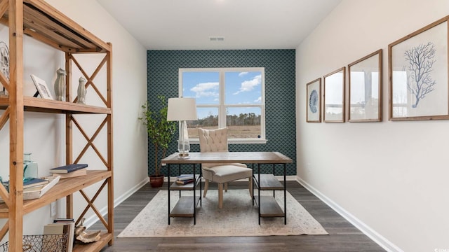 home office with dark hardwood / wood-style flooring and breakfast area