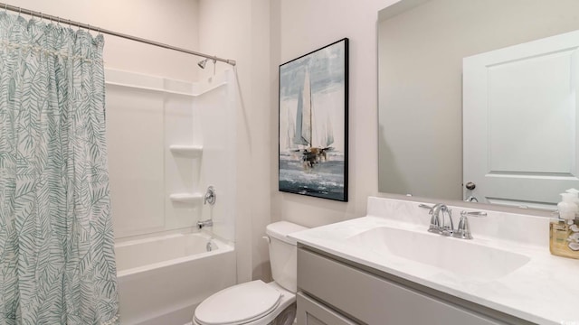 full bathroom with vanity, shower / bath combination with curtain, and toilet