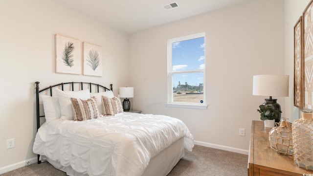 bedroom featuring light carpet