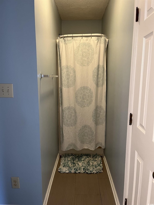 bathroom with a textured ceiling