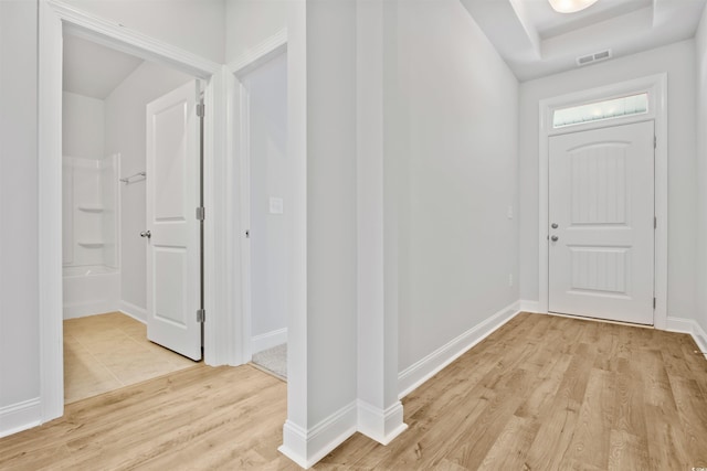 entrance foyer with visible vents, baseboards, and light wood finished floors