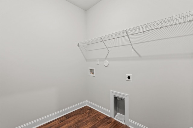 clothes washing area with hookup for an electric dryer, washer hookup, laundry area, and baseboards
