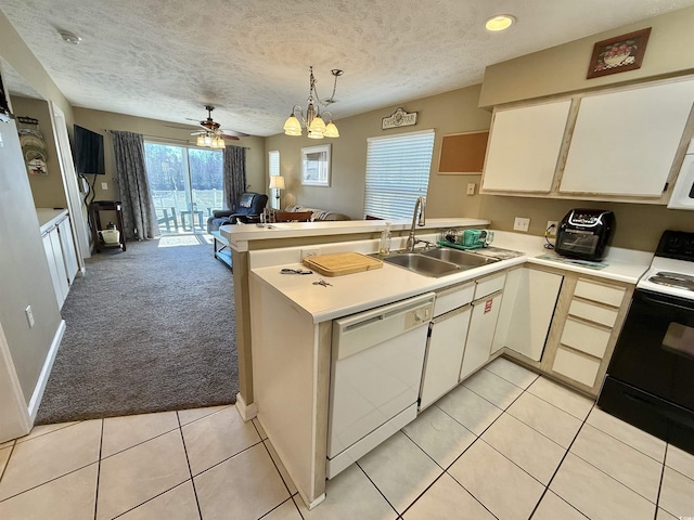 kitchen featuring dishwasher, sink, light colored carpet, kitchen peninsula, and black electric range