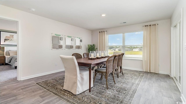 dining area featuring light wood-type flooring