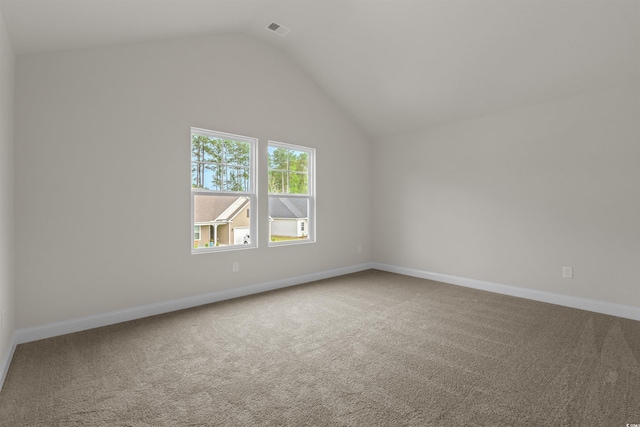 1212 NW Calabash Station Blvd, Calabash, NC 28467 - spare room featuring visible vents, vaulted ceiling, and carpet floors