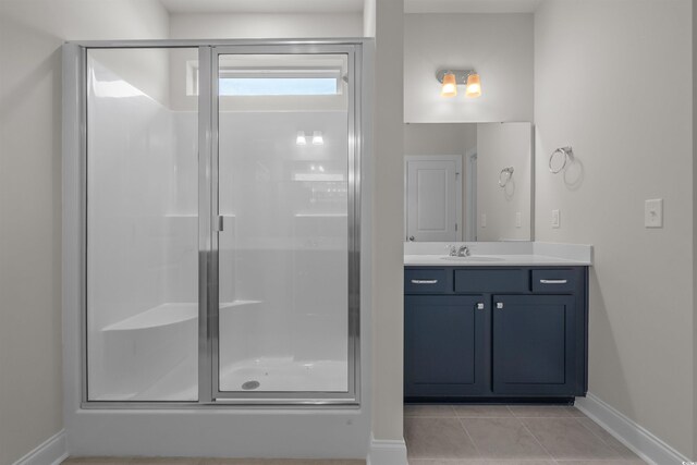 1212 NW Calabash Station Blvd, Calabash, NC 28467 - bathroom with tile patterned floors, a stall shower, vanity, and baseboards