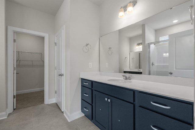 1212 NW Calabash Station Blvd, Calabash, NC 28467 - bathroom with tile patterned floors, vanity, a spacious closet, and baseboards