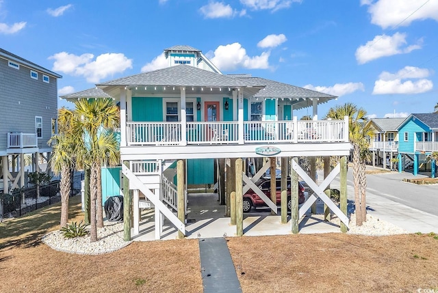 view of front of property featuring a carport and covered porch