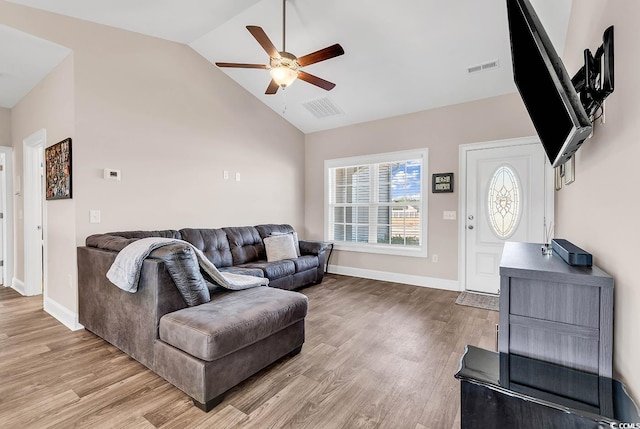 living room featuring high vaulted ceiling, ceiling fan, and light hardwood / wood-style flooring