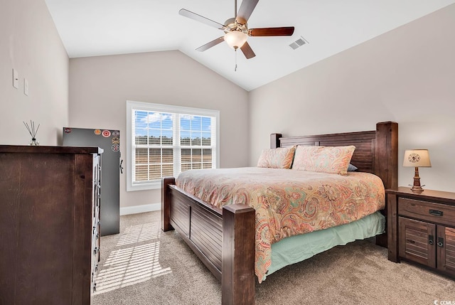 carpeted bedroom featuring ceiling fan and lofted ceiling