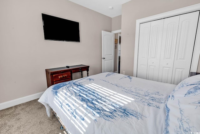 bedroom featuring light carpet and a closet