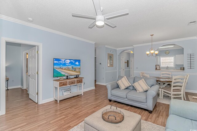 living room featuring crown molding, sink, a textured ceiling, and light hardwood / wood-style floors