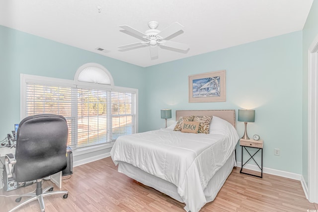 bedroom with light hardwood / wood-style flooring and ceiling fan