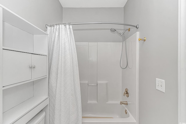 bathroom featuring shower / bathtub combination with curtain