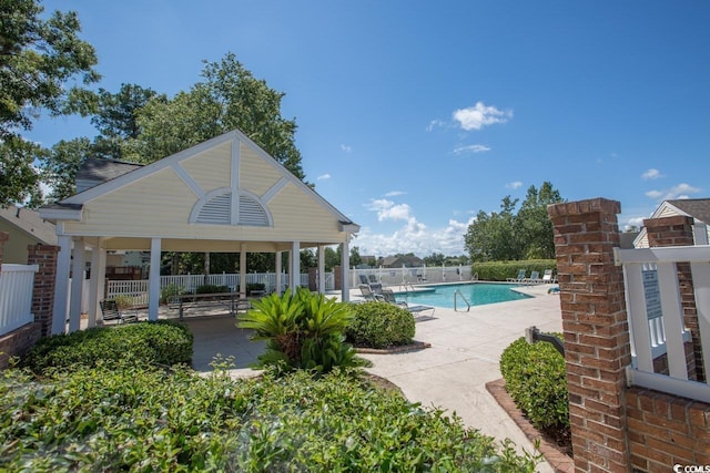 view of swimming pool featuring a gazebo and a patio area