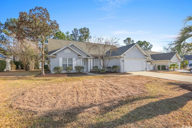 ranch-style home featuring a garage and a front lawn