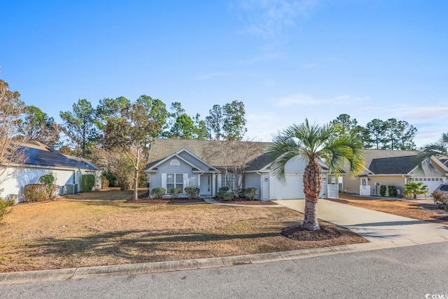 single story home featuring a garage and a front lawn