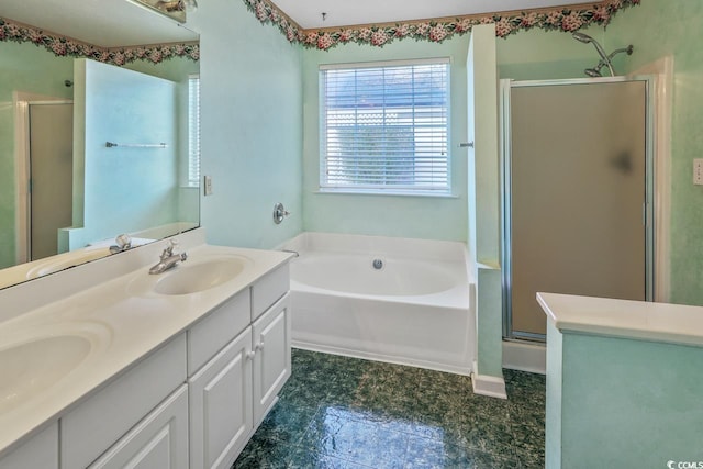 bathroom with vanity and shower with separate bathtub