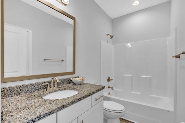 full bathroom featuring  shower combination, toilet, and vanity