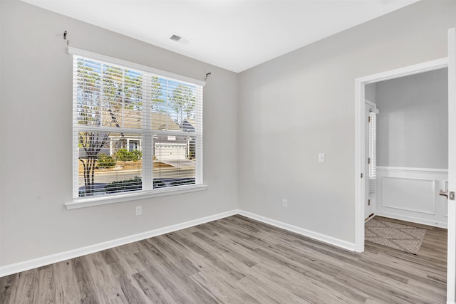 spare room with light wood-type flooring