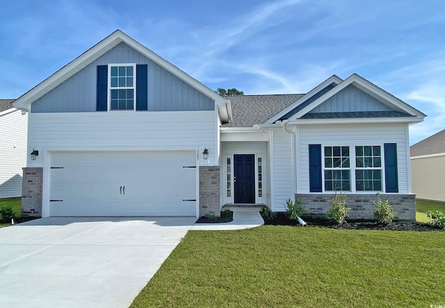 craftsman house featuring board and batten siding, concrete driveway, a front yard, a shingled roof, and a garage