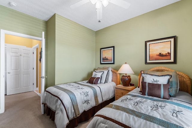 carpeted bedroom with a ceiling fan