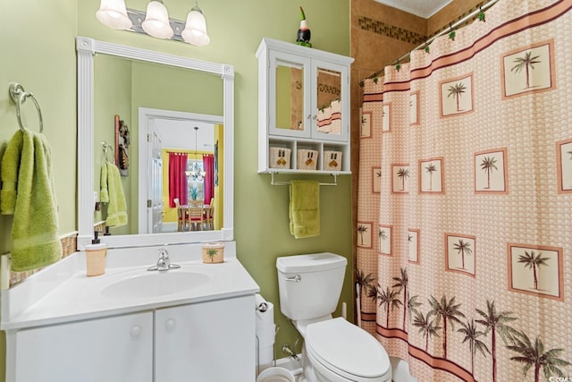 bathroom featuring a shower with curtain, toilet, and vanity