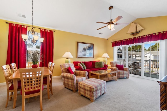 living room featuring visible vents, lofted ceiling, carpet flooring, and ceiling fan with notable chandelier