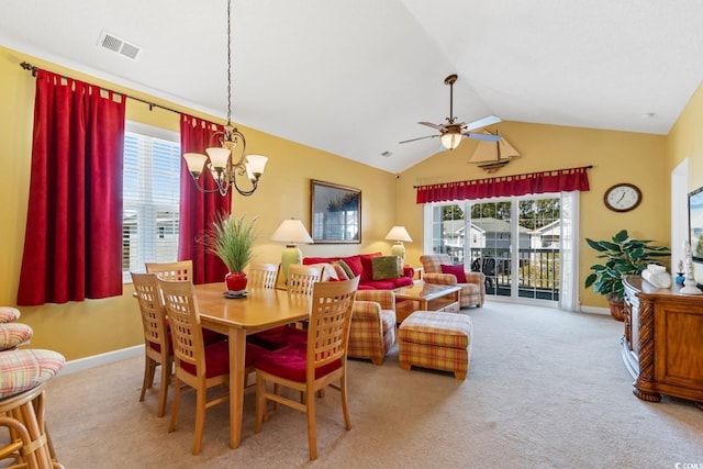 dining area featuring visible vents, plenty of natural light, ceiling fan with notable chandelier, and vaulted ceiling