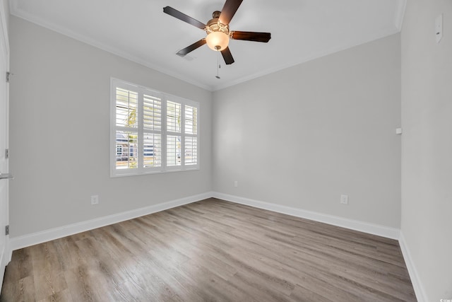 unfurnished room featuring ceiling fan, ornamental molding, and light wood-type flooring