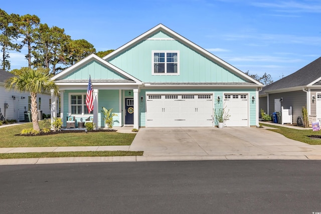 craftsman-style house featuring a porch and a garage