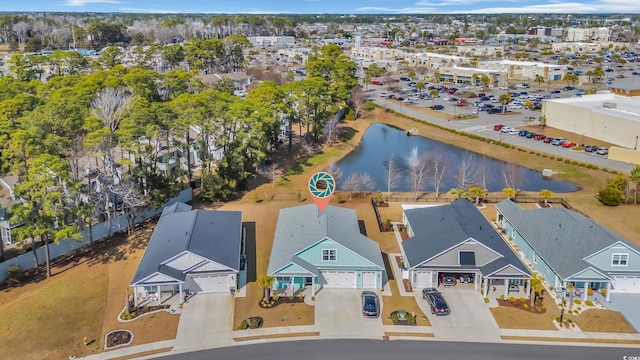 birds eye view of property with a water view